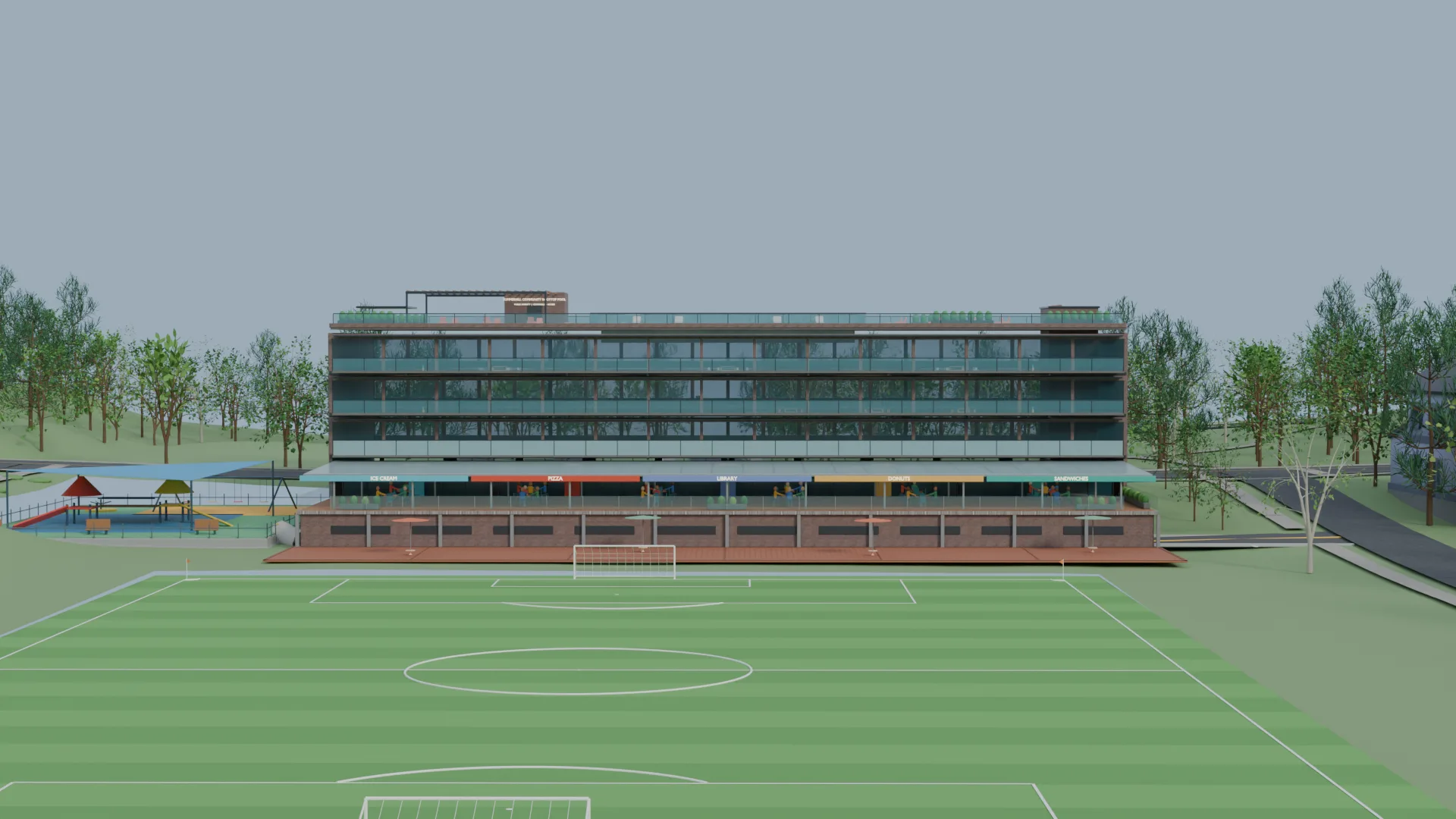 Rear of the community center overlooking a playing field, with a terrace and play area
